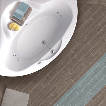 Bath in the corner of the bathroom.